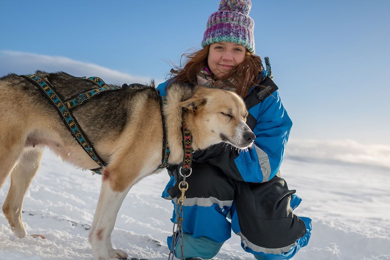Ju wrapped up warm with one of the running dogs
